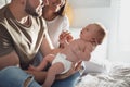 Happy couple with their newborn baby at home Royalty Free Stock Photo