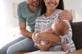 Happy couple with their newborn baby at home Royalty Free Stock Photo