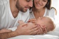 Happy couple with their newborn baby at home Royalty Free Stock Photo