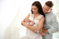 Happy couple with their newborn baby at home Royalty Free Stock Photo