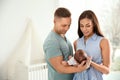 Happy couple with their newborn baby at home Royalty Free Stock Photo