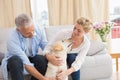 Happy couple with their pet dog Royalty Free Stock Photo