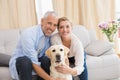 Happy couple with their pet dog Royalty Free Stock Photo