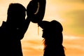Happy couple together at sunset silhouette of natur Royalty Free Stock Photo