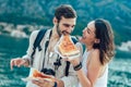 Couple of tourist eating pizza on street Royalty Free Stock Photo