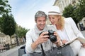 Happy couple of tourists taking photos Royalty Free Stock Photo