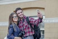 Happy couple of tourists taking selfie in showplace of city Royalty Free Stock Photo