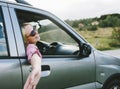 Happy couple travel by car in countryside. Young cool people on adventure road trip in mountains. Man and woman on escape romantic Royalty Free Stock Photo