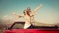 Happy couple travel by car in the mountains Royalty Free Stock Photo