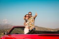 Happy couple travel by car in the mountains Royalty Free Stock Photo