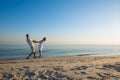 Happy couple of travelers are spinning, holding hands Royalty Free Stock Photo