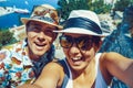 Happy couple travelers are taking selfie photo on Greek island of Symi, Dodecanese, Greece Royalty Free Stock Photo