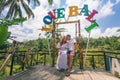 Happy couple traveling at Bali, rice terraces of Tegalalang, Ubud