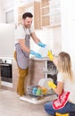 Happy couple unloading dishwasher Royalty Free Stock Photo