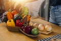 Happy couple using laptop computer preparing healthy food diet vegetable salad at home together. Woman and man are searching Royalty Free Stock Photo