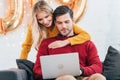 happy couple using laptop at home Royalty Free Stock Photo