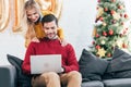 happy couple using laptop together at home Royalty Free Stock Photo