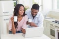 Happy couple using laptop together Royalty Free Stock Photo