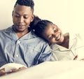 A happy couple using mobile phones in bed Royalty Free Stock Photo