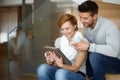 Happy couple using tablet at home Royalty Free Stock Photo