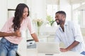 Happy couple using their laptop at breakfast Royalty Free Stock Photo