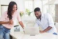 Happy couple using their laptop at breakfast Royalty Free Stock Photo