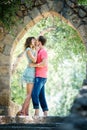 Happy couple on vacation. Happy guy and girl. Lovers enjoy each other in the evening park Royalty Free Stock Photo