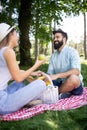 Happy couple on vacation. Lovers enjoy each other in the park, picnic Royalty Free Stock Photo