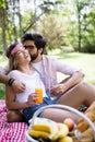 Happy couple on vacation. Lovers enjoy each other in the park, picnic Royalty Free Stock Photo