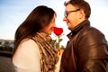 Couple enjoying the sun on the roof with red rose Royalty Free Stock Photo