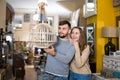 Happy couple with vintage suspended lamp