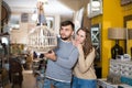 Happy couple with vintage suspended lamp