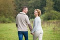 Happy couple walking in the countryside