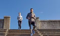 Happy couple walking downstairs on stadium Royalty Free Stock Photo