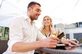 Happy couple with wallet paying bill at restaurant Royalty Free Stock Photo