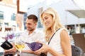 Happy couple with wallet paying bill at restaurant Royalty Free Stock Photo