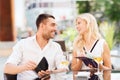 Happy couple with wallet paying bill at restaurant Royalty Free Stock Photo