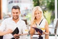 Happy couple with wallet paying bill at restaurant Royalty Free Stock Photo