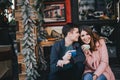 Happy couple in warm clothes drinking coffee on a Christmas market Royalty Free Stock Photo