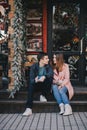 Happy couple in warm clothes drinking coffee on a Christmas market Royalty Free Stock Photo