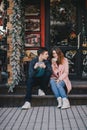 Happy couple in warm clothes drinking coffee on a Christmas market Royalty Free Stock Photo