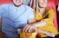 Happy couple watching movie in theater or cinema Royalty Free Stock Photo