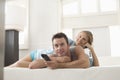 Happy Couple Watching TV At Home Royalty Free Stock Photo