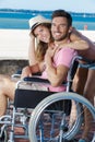 Happy couple in wheelchairs outdoors Royalty Free Stock Photo