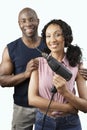 Happy Couple With Woman Holding Drill