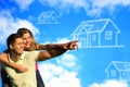 Happy couple under the blue sky dreaming of a hous Royalty Free Stock Photo