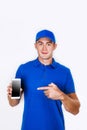 Happy courier with phone. looking at camera. isolated gray background. Studio shoot