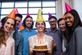 Happy coworkers celebrating a birthday Royalty Free Stock Photo