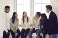 Group of happy young multiracial coworkers or friends talking about funny stuff and smiling Royalty Free Stock Photo
