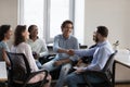 Happy coworkers shaking hands, expressing recognition, acknowledgement, gratitude Royalty Free Stock Photo